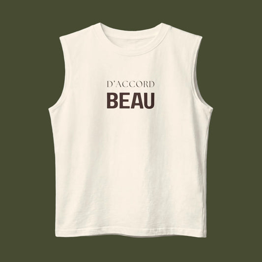 An off-white sleeveless crop top with the French phrase 'D'ACCORD BEAU' printed in dark brown on the chest, displayed against a clean white background.