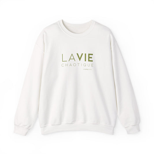 An off-white crewneck sweatshirt with “LA VIE CHAOTIQUE” printed in olive green and “BY CHTQ DESIGN” beneath the graphic, displayed against a clean white background.
