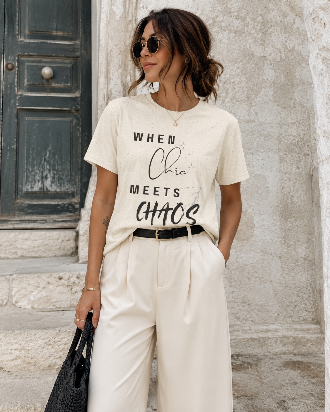 Woman wearing natural color T-shrit with text 'When Chic Meets Chaos'