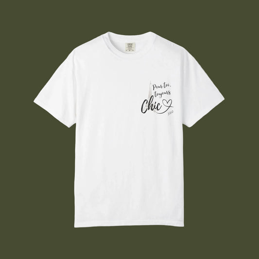 An off-white short-sleeve crewneck t-shirt with a small graphic on the left chest that reads 'pour toi toujours Chic' in black and gray lettering with a small heart below, displayed on a clean white background.