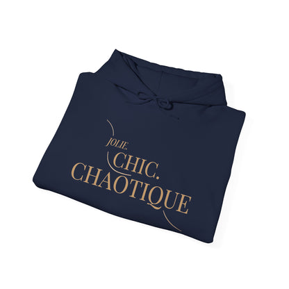 Folded navy hoodie with frog graphic and 'Jolie. Chic. Chaotique' text on a white background
