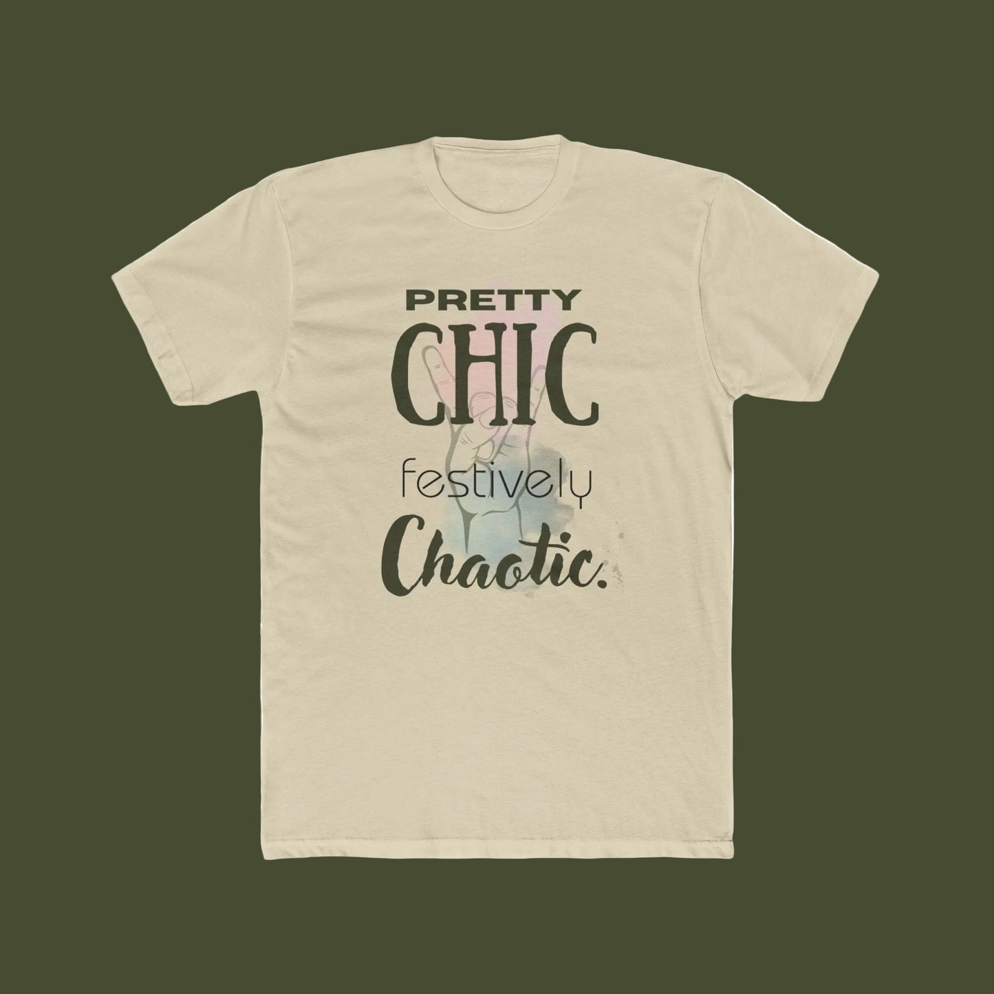 A beige short-sleeve crewneck t-shirt featuring a graphic print on the front with the text 'PRETTY CHIC festively Chaotic.' in black and gray lettering over a faint pastel illustration.
