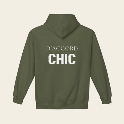 An olive green pullover hoodie shown from the back, featuring the words 'D'ACCORD CHIC' printed in white across the upper back.
