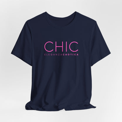 Navy blue graphic T-shirt with pink 'CHIC ELEGANZA CAOTICA' typography on a neutral gray studio background.