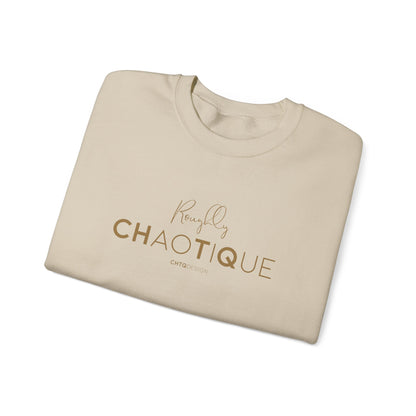 Folded Beige Roughly Chaotique crewneck sweatshirt with gold typography and CHTQ Design signature on the front, displayed against a clean white background.