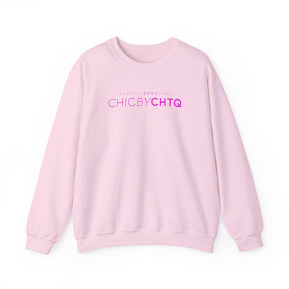 A light pink color crewneck sweatshirt with text reading “CHIC BY CHTQ” and “REBELLE DANS L’ÂME” printed across the chest.