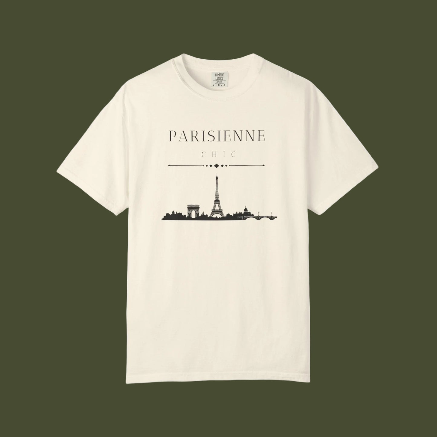An off-white short-sleeve crewneck t-shirt featuring a black graphic print of the Paris skyline with the text 'PARISIENNE CHIC' above it, displayed on a clean white background.