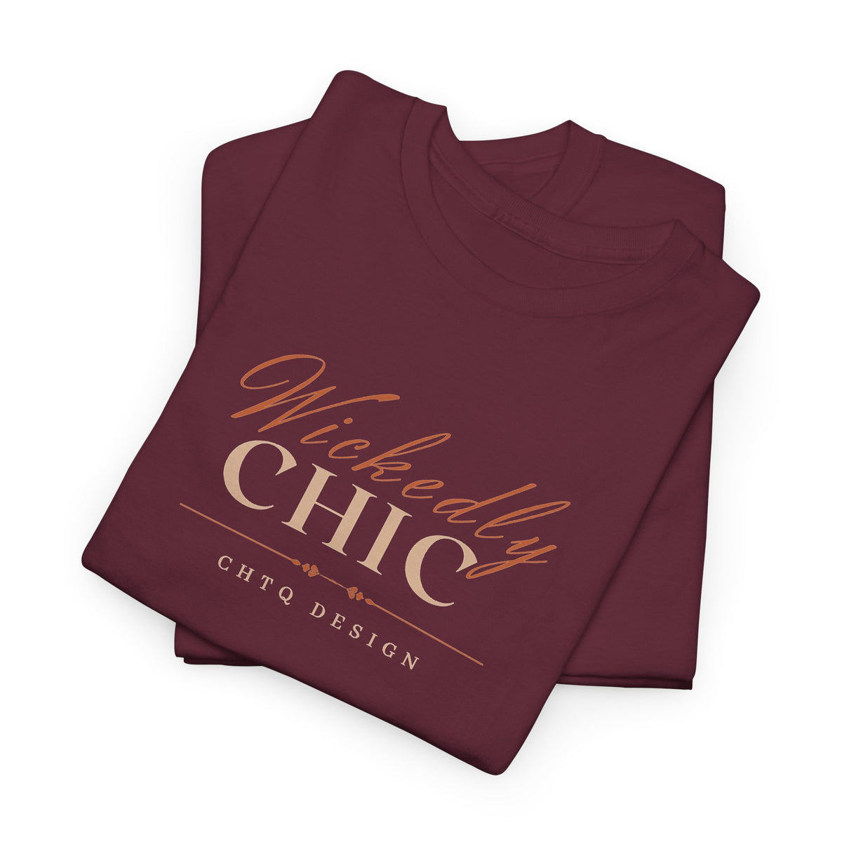 Folded Maroon Wickedly Chic Graphic T-Shirt featuring elegant copper-colored script lettering, cream CHIC typography, and subtle CHTQ Design detailing on the front. Front view on a white background.