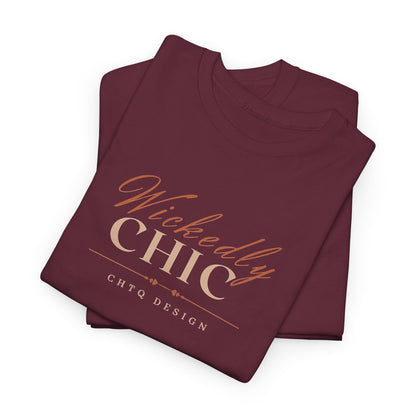 Folded Maroon Wickedly Chic Graphic T-Shirt featuring elegant copper-colored script lettering, cream CHIC typography, and subtle CHTQ Design detailing on the front. Front view on a white background.