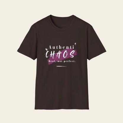 A dark brown short-sleeve t-shirt with a graphic on the chest that reads 'Authenti CHAOS Real, not perfect.' in white and purple text over a purple paint splatter background.