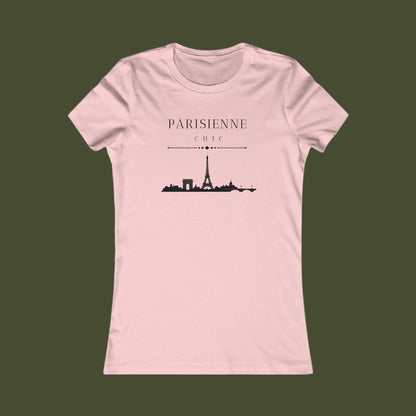 A light pink short-sleeve crewneck t-shirt with a black graphic of the Paris skyline and the text 'PARISIENNE CHIC' printed on the chest, displayed against a solid white background.