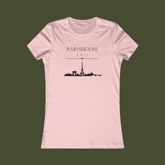 A light pink short-sleeve crewneck t-shirt with a black graphic of the Paris skyline and the text 'PARISIENNE CHIC' printed on the chest, displayed against a solid white background.