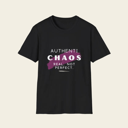A black short-sleeve crewneck t-shirt with a graphic on the chest that reads 'AUTHENTICHAOS REAL, NOT PERFECT.' in white and purple text over a purple paint-splatter shape.