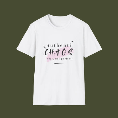 A white short-sleeve crewneck t-shirt with a graphic print on the chest that reads 'AuthentiCHAOS Real, not perfect.' in black and light pink lettering, displayed on a clean white background.