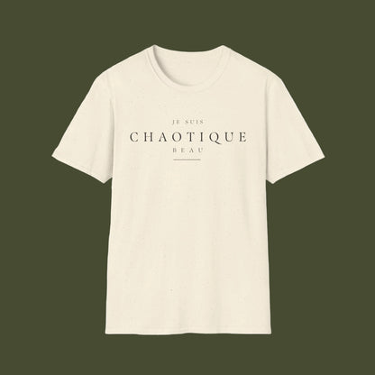 An off-white short-sleeve crewneck t-shirt with the French text 'JE SUIS CHAOTIQUE BEAU' printed in black across the chest, displayed on a clean white background.