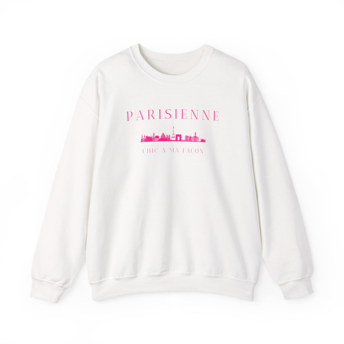 A off-white crewneck sweatshirt with a bright pink “PARISIENNE” graphic, Paris skyline design, and “CHIC À MA FAÇON” text on the chest, displayed against a clean white background.