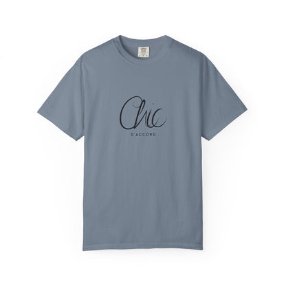 A blue jean short-sleeve T-shirt featuring a pink “Chic D’Accord” graphic on the chest, displayed against a clean white background.