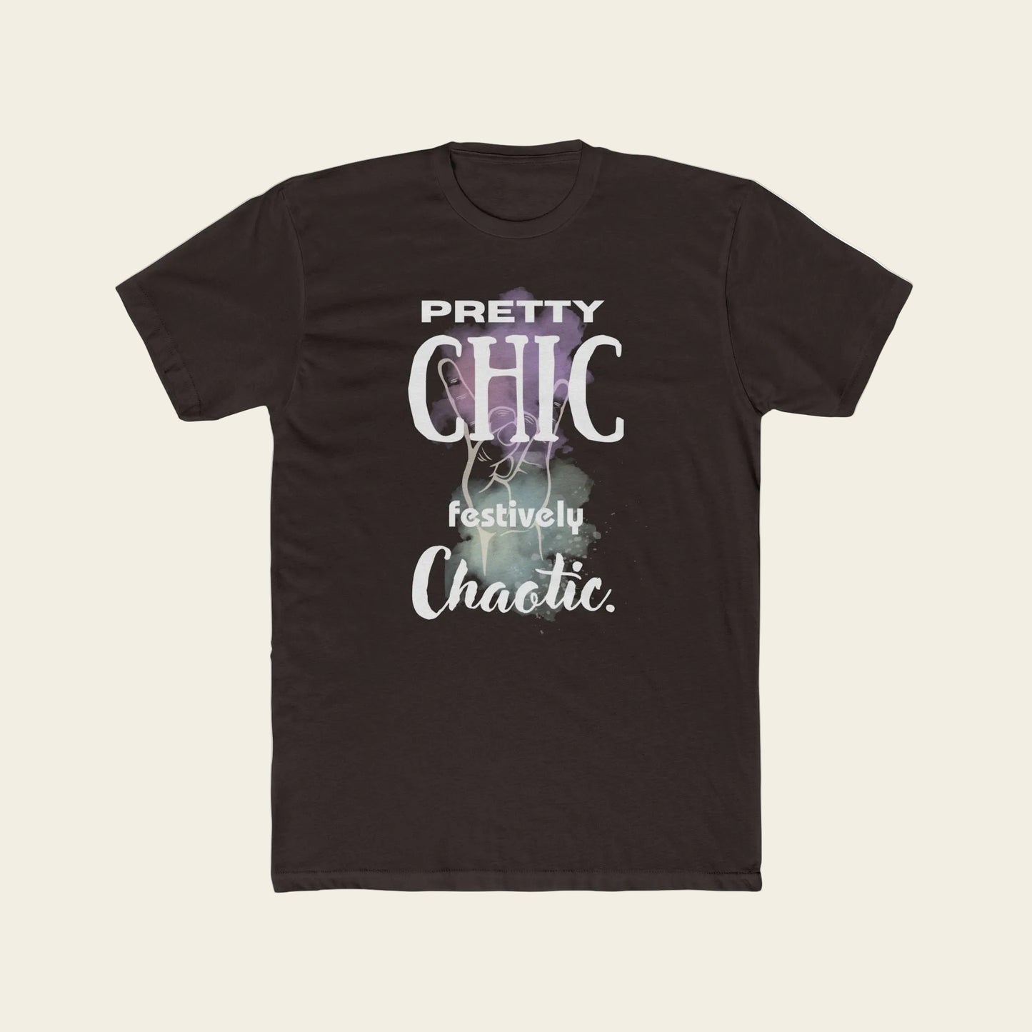 A dark brown short-sleeve crewneck t-shirt with a graphic print on the front. The graphic features the text 'PRETTY CHIC festively Chaotic.