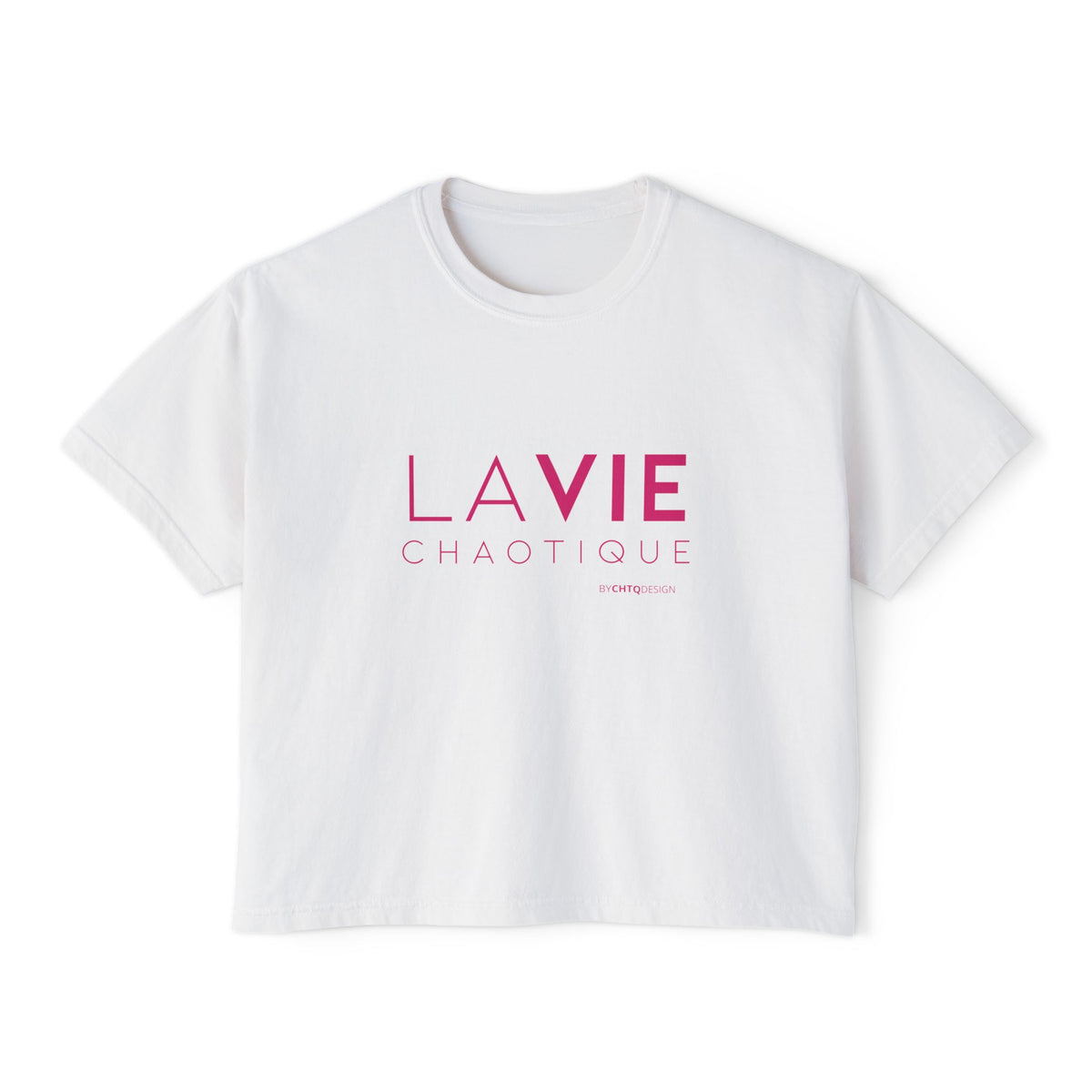 A white short-sleeve boxy T-shirt with a slightly cropped fit, featuring “LA VIE CHAOTIQUE” typography in pink on the front with a small CHTQ Design signature underneath, displayed against a clean white background.