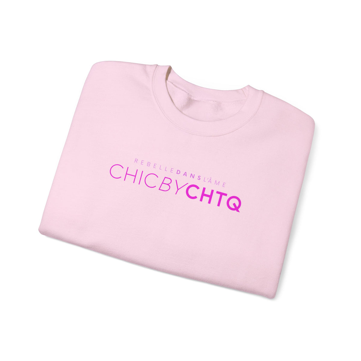 A light pink color crewneck sweatshirt with text reading “CHIC BY CHTQ” and “REBELLE DANS L’ÂME” printed across the chest.