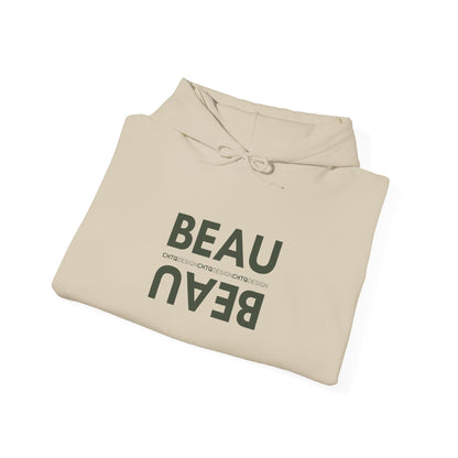 A folded beige BEAU graphic hoodie with a mirrored dusty dark BEAU print and CHTQ Design detail on the chest, displayed against a white background.