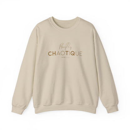 Beige Roughly Chaotique crewneck sweatshirt with gold typography and CHTQ Design signature on the front, displayed against a clean white background.