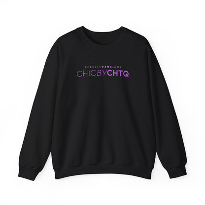 A black crewneck sweatshirt with text reading “CHIC BY CHTQ” and “REBELLE DANS L’ÂME” printed across the chest.