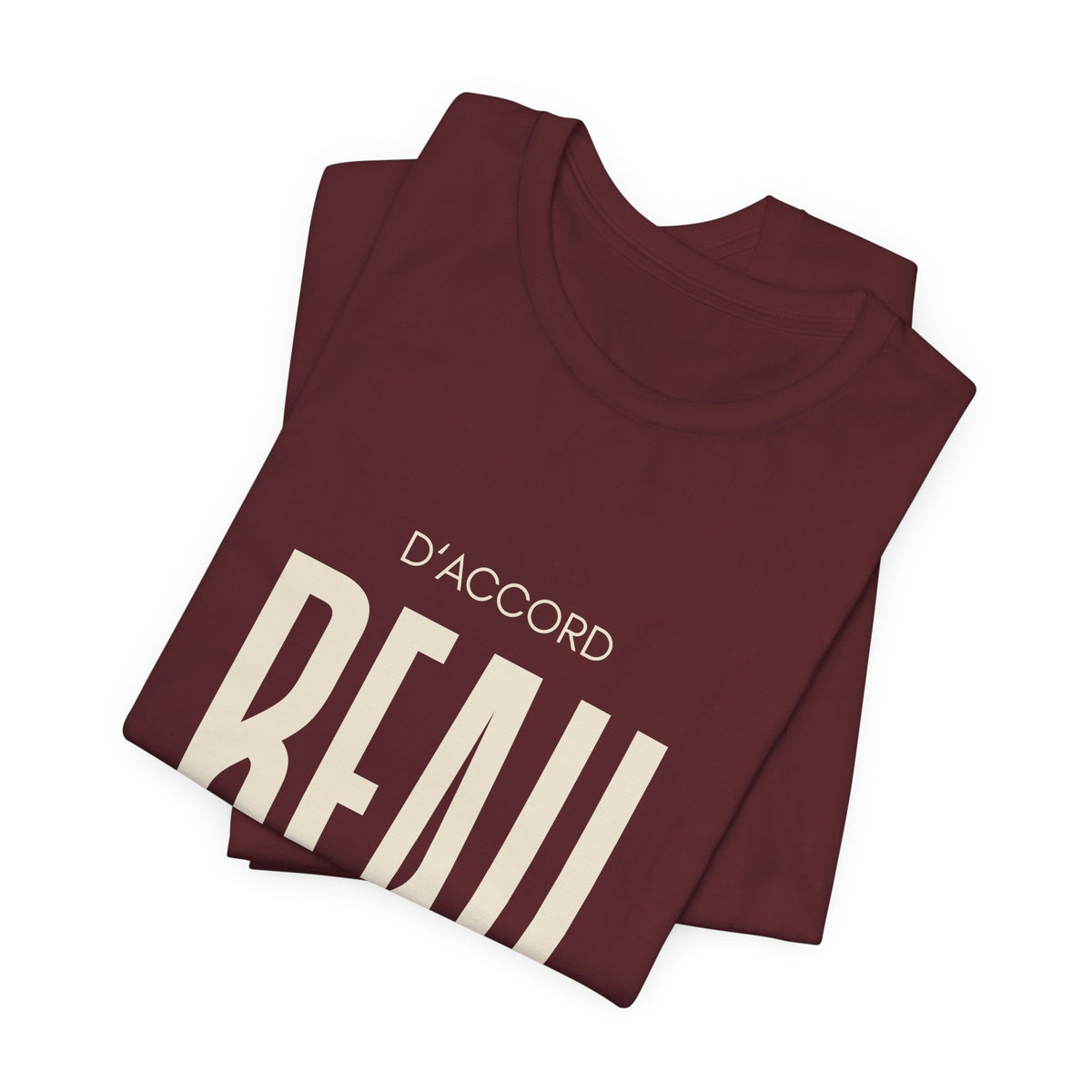 Folded D’ACCORD BEAU Graphic T-Shirt by CHTQ Design in maroon featuring bold cream BEAU lettering, D’ACCORD text and a small CHTQ Design signature.