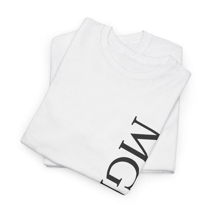 A folded white crewneck t-shirt with a large black graphic print of the letters 'MGNFQ' on the sleeve, displayed on a clean white background.
