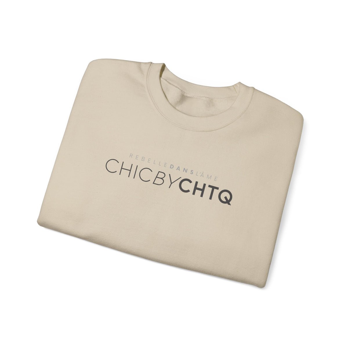 A sand color crewneck sweatshirt with text reading “CHIC BY CHTQ” and “REBELLE DANS L’ÂME” printed across the chest.