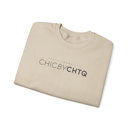 A sand color crewneck sweatshirt with text reading “CHIC BY CHTQ” and “REBELLE DANS L’ÂME” printed across the chest.