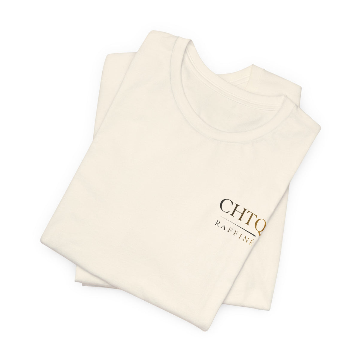A folded light crewneck t-shirt with a small text CHTQ Raffine on the left chest, displayed on a clean white background.
