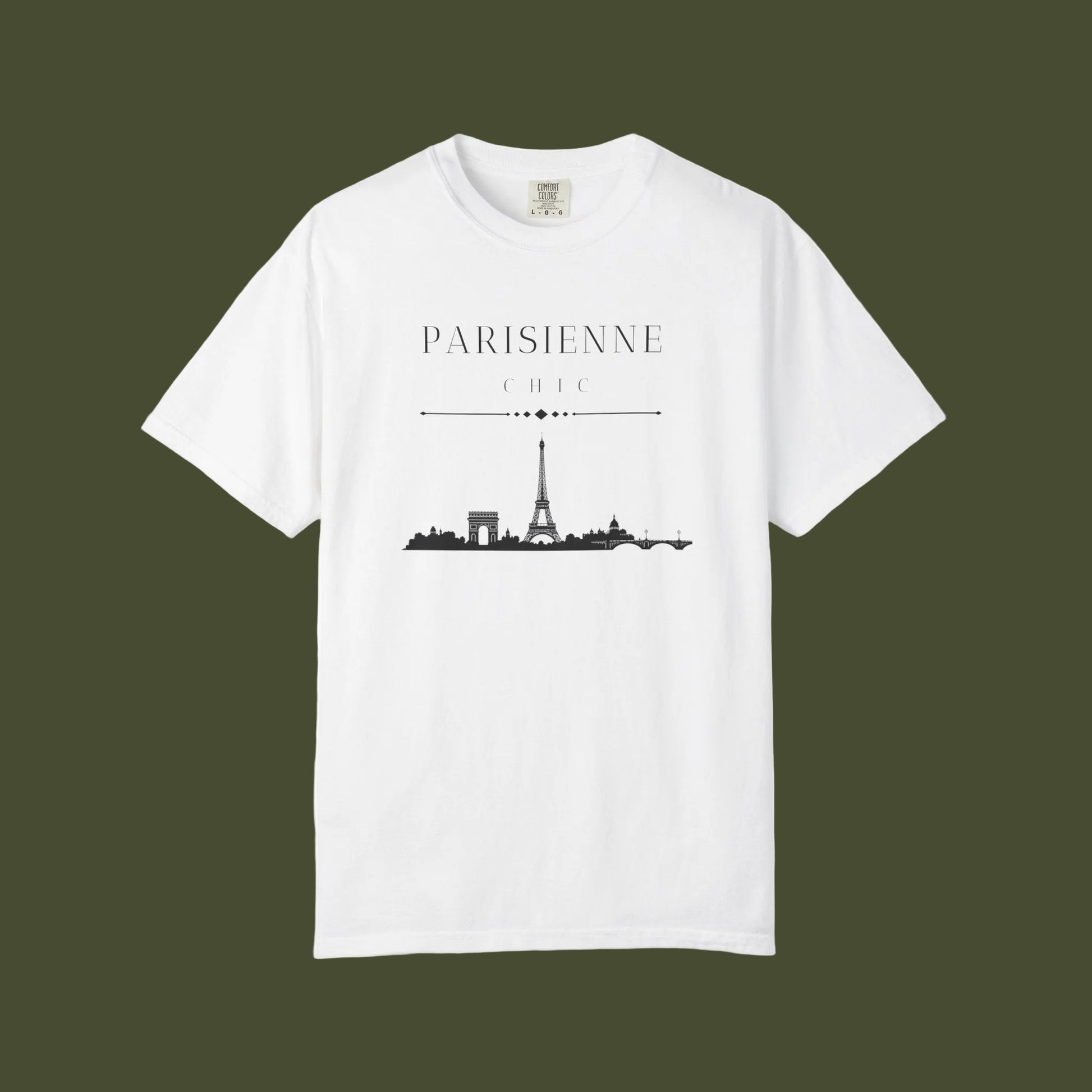 A white short-sleeve crewneck t-shirt featuring a black graphic print of the Paris skyline with the text 'PARISIENNE CHIC' above it, displayed on a clean white background.