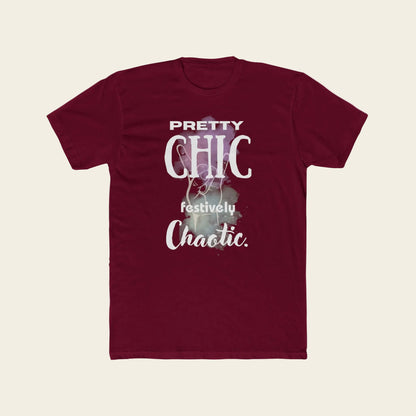 A maroon short-sleeve crewneck t-shirt with a graphic print on the front that reads 'PRETTY CHIC festively Chaotic.' in white and light purple text over a faint festive illustration.