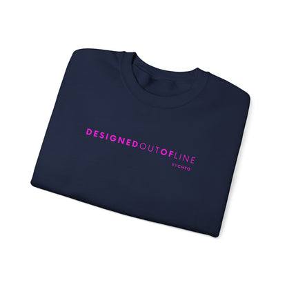 A folded navy blue crewneck sweatshirt featuring pink “DESIGNED OUT OF LINE” text across the chest, with a small “BY CHTQ” detail underneath, displayed against a clean white background.