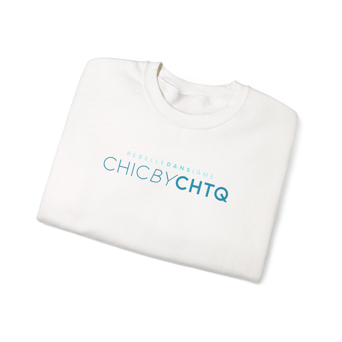 A white crewneck sweatshirt with text reading “CHIC BY CHTQ” and “REBELLE DANS L’ÂME” printed across the chest.