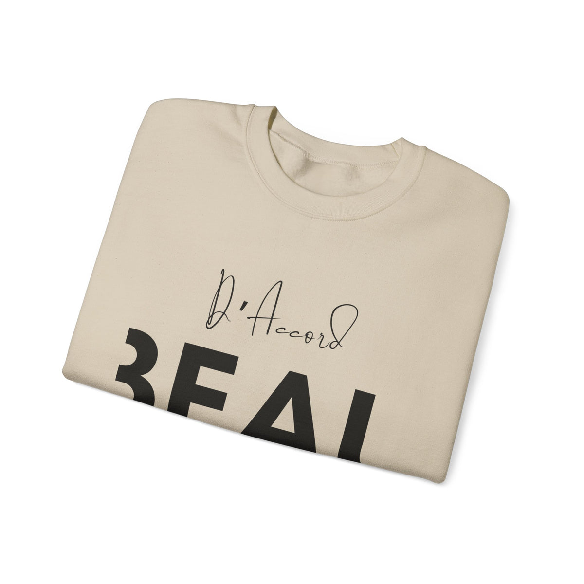 Folded sand BEAU D’ACCORD graphic crewneck sweatshirt with black handwritten and bold lettering on the front.