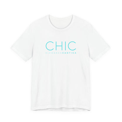 A white short-sleeve crewneck T-shirt with 'CHIC' printed in light blue sans-serif typography and 'ELEGANZA CAOTICA' in smaller text underneath, shown against a light gray gradient studio background.