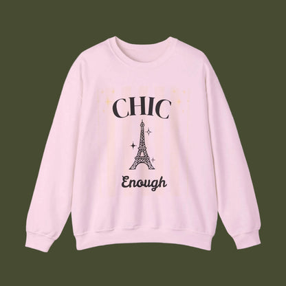 Pink sweatshirt with Eiffel Tower graphic and text on a white background