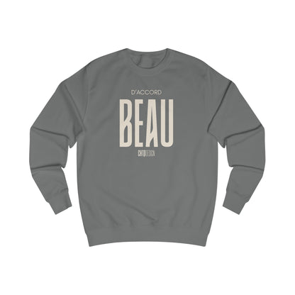 A dark gray crewneck sweatshirt with a beige graphic print on the front reading 'D'ACCORD BEAU' on a solid white background.