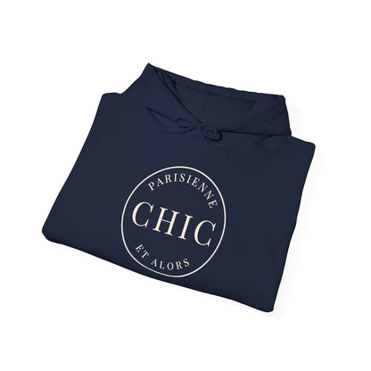 Folded  navy blue hoodie featuring a cream circular “PARISIENNE CHIC ET ALORS” graphic on the front, displayed against a clean white background.