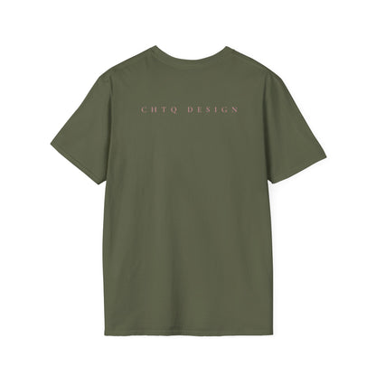 A green crewneck T-shirt from backwith pink “CHTQ DESIGN” and “MORE THAN A SHIRT, IT’S A MOVEMENT” text on the front, paired with black pants against a plain white background.