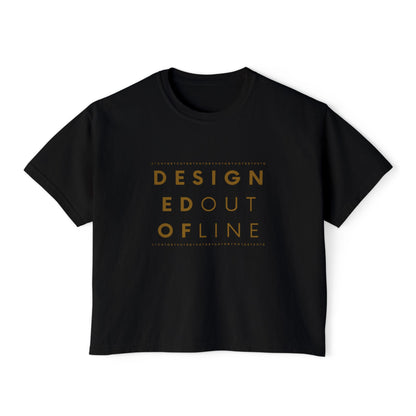 A black short-sleeve boxy T-shirt with a slightly cropped fit and a gold typography graphic on the front reading “DESIGNED OUT OF LINE.”