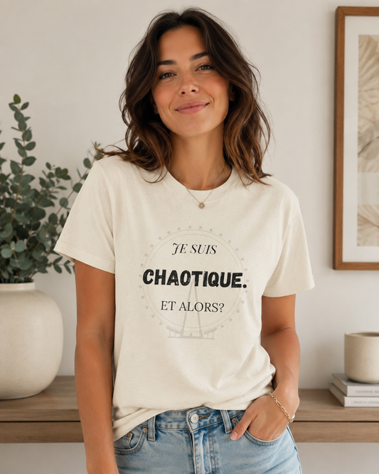 Woman wearing a white t-shirt with text in a home setting