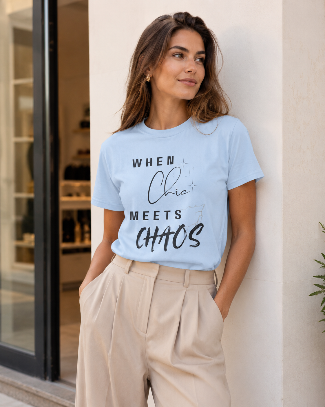 Woman wearing light blue 'When Chic Meets Chaos' t-shirt