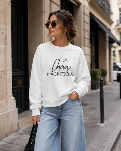 Woman with white sweatshirt with text 'UN Chaos MAGNIFIQUE'