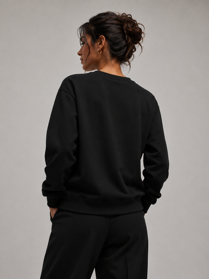 Woman wearing black sweatshirt from backside 