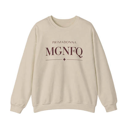 A beige crewneck sweatshirt featuring cream-colored “PRIMADONNA MGNFQ” text on the chest, accented with a decorative line and small diamond detail, against a neutral gray background.
