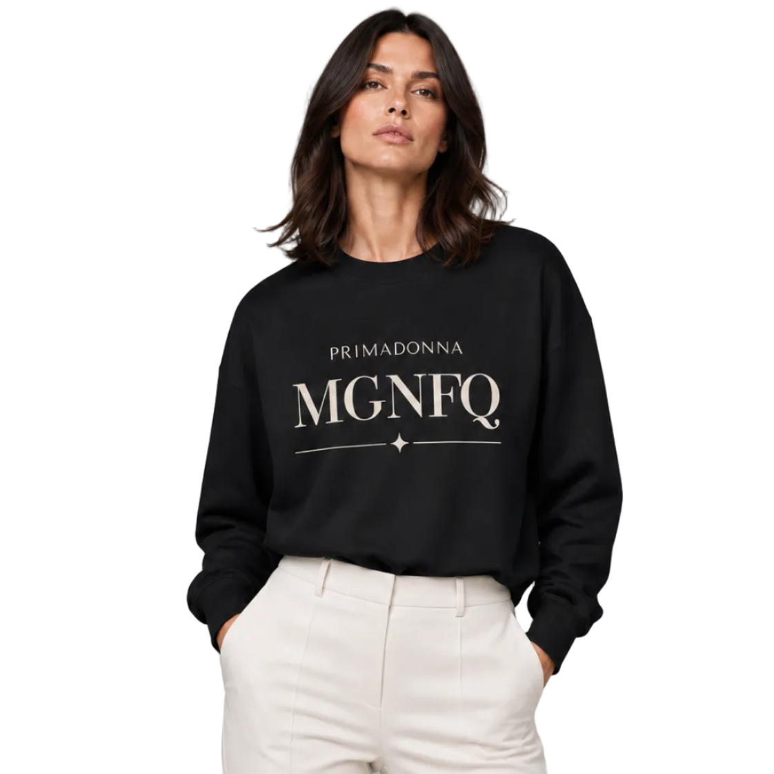 A woman modeling a black crewneck sweatshirt with 'PRIMADONNA MGNFQ' printed in white on the front, paired with off-white trousers, against a solid gray studio background.