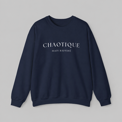 Navy blue sweatshirt on a white background featuring a “Chaotique Mais Raffiné” graphic text print.